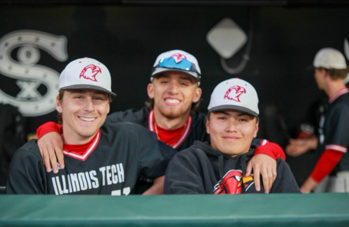 Ethan with Illinois Tech teammates in the dugout
