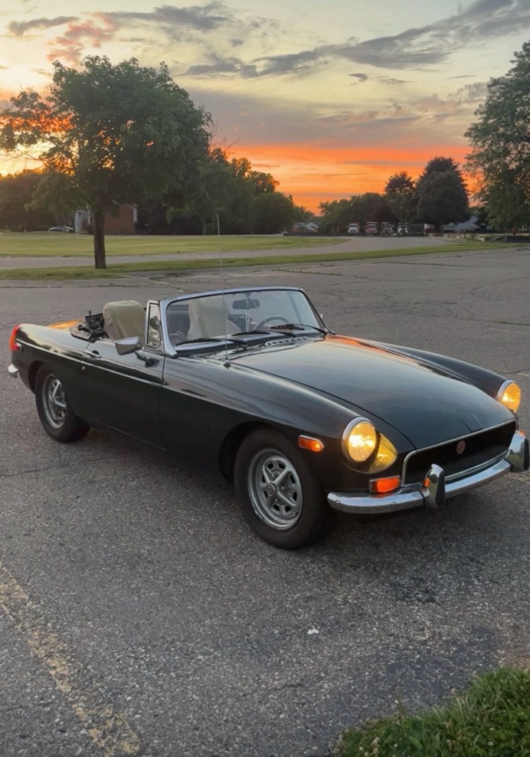 Ethan's dark green 1972 MGB roadster at sunset
